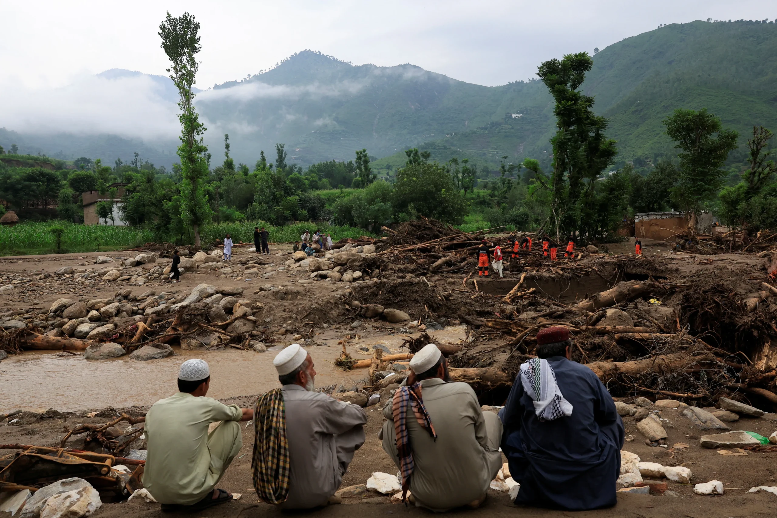 Rains sweep away villages in worst-hit Khyber Pakhtunkhwa province as rescuers search for 150 missing people.