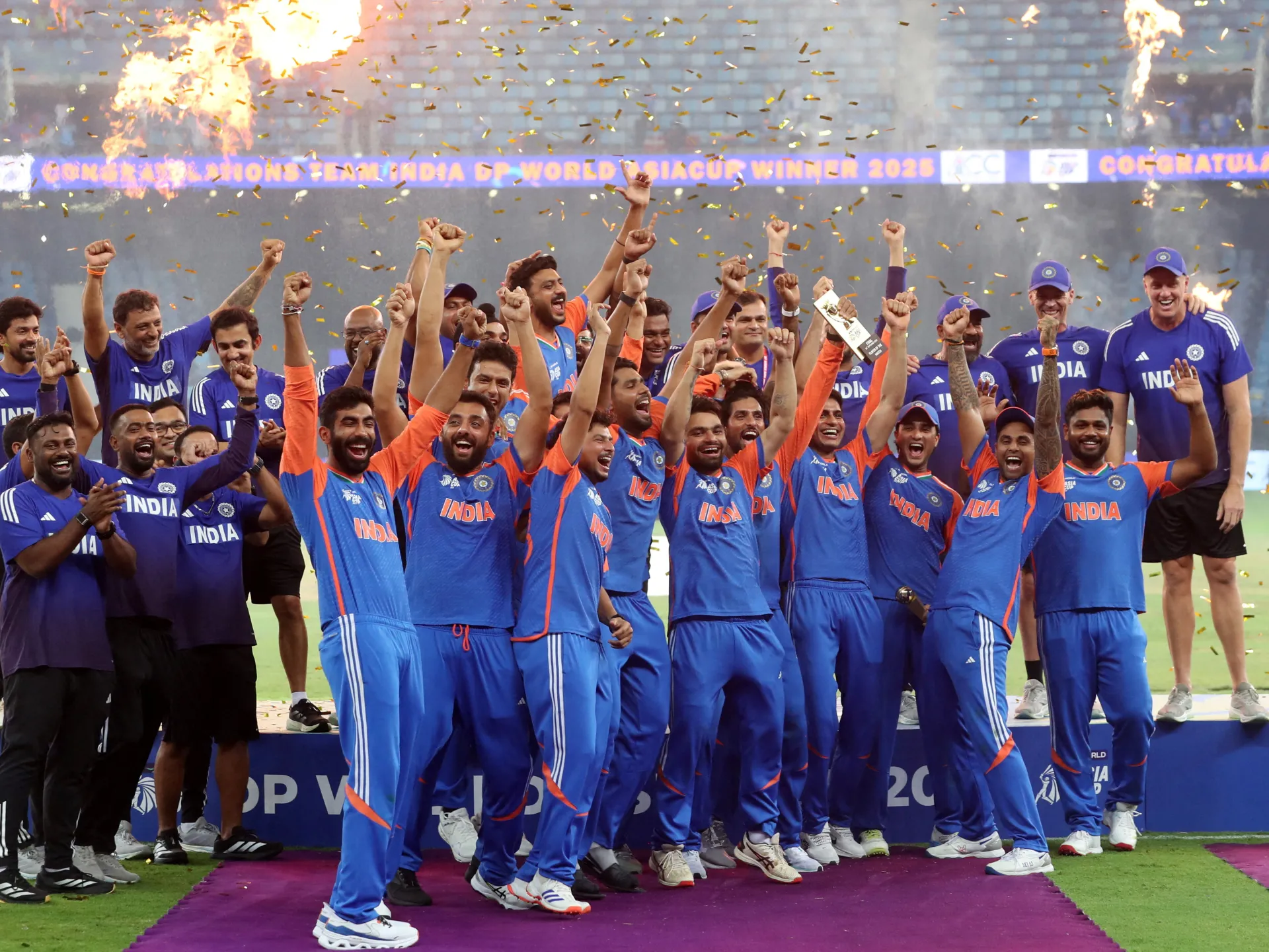 "Indian cricketers rejoice at their Asia Cup victory during the award ceremony .
