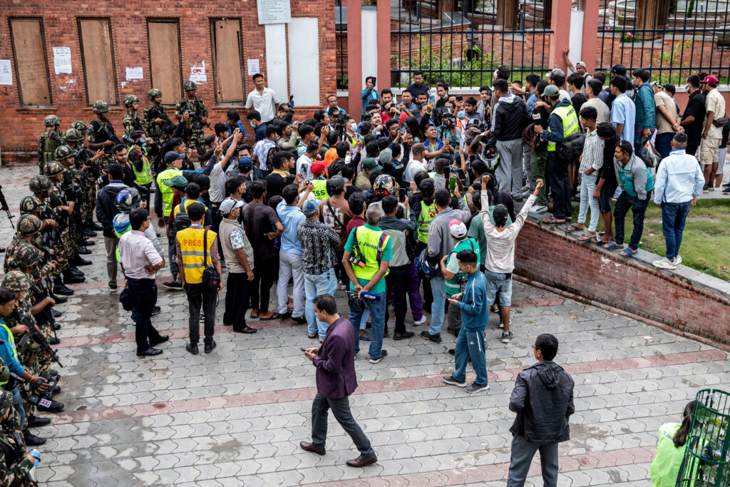 Protesters gather outside Nepal's army headquarters during a curfew imposed to restore law and order in Kathmandu on September 11, 2025